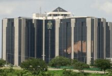 The Central Bank of Nigeria (CBN) has imposed fines totaling N1.35 billion on nine Deposit Money Banks (DMBs) for failing to ensure cash availability via automated teller machines (ATMs) during the festive season. In a statement issued on Tuesday, the CBN’s acting Director of Corporate Communications, Mrs. Hakama Sidi Ali, disclosed that each bank was fined N150 million following spot checks that revealed non-compliance with the apex bank’s cash distribution guidelines. “In a clear message of zero tolerance for cash flow disruptions, the Central Bank of Nigeria has sanctioned Deposit Money Banks for failing to make naira notes available through automated teller machines during the yuletide season,” the statement read. The affected banks include: Fidelity Bank Plc First Bank Plc Keystone Bank Plc Union Bank Plc Globus Bank Plc Providus Bank Plc Zenith Bank Plc United Bank for Africa Plc Sterling Bank Plc The fines will be directly debited from the banks’ accounts with the CBN. The apex bank emphasized that the enforcement action follows repeated warnings to financial institutions to ensure seamless cash availability, especially during periods of high demand.