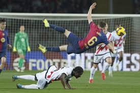 Barcelona saw out a nervy win against Rayo Vallecano to return to the top of La Liga for the first time since December.

Robert Lewandowski's first-half penalty was enough for Barca to leapfrog title rivals Real Madrid and Atletico Madrid, after both capital clubs dropped points in 1-1 draws on Saturday.

The Poland striker rolled his spot-kick in off the post - his 20th league goal of the season - after the hosts were awarded a contentious penalty following a video assistant referee (VAR) review.

Rayo midfielder Pathe Ciss was penalised for pulling down Inigo Martinez in the box, though the Barcelona centre-back was never close to getting to the ball ahead of goalkeeper Augusto Batalla.

The visitors were incensed when they were denied a penalty following a similar incident, this time Ciss going to ground.

The controversy continued as Rayo thought they had equalised when Jorge de Frutos latched on to a through ball and finished past Wojciech Szczesny, but striker Randy Nteka - standing in an offside position - was judged to have interfered with Martinez's ability to make a tackle.

Barcelona spurned several chances to score in the second half, and were fortunate not to concede a late equaliser when De Frutos headed over following a Rayo counter-attack.

Hansi Flick's side go top of the table with 51 points, ahead of Real Madrid on goal difference, and one point above Atletico, with 14 games left to play.

Barcelona saw out a nervy win against Rayo Vallecano to return to the top of La Liga for the first time since December.

Robert Lewandowski's first-half penalty was enough for Barca to leapfrog title rivals Real Madrid and Atletico Madrid, after both capital clubs dropped points in 1-1 draws on Saturday.

The Poland striker rolled his spot-kick in off the post - his 20th league goal of the season - after the hosts were awarded a contentious penalty following a video assistant referee (VAR) review.

Rayo midfielder Pathe Ciss was penalised for pulling down Inigo Martinez in the box, though the Barcelona centre-back was never close to getting to the ball ahead of goalkeeper Augusto Batalla.

The visitors were incensed when they were denied a penalty following a similar incident, this time Ciss going to ground.

The controversy continued as Rayo thought they had equalised when Jorge de Frutos latched on to a through ball and finished past Wojciech Szczesny, but striker Randy Nteka - standing in an offside position - was judged to have interfered with Martinez's ability to make a tackle.

Barcelona spurned several chances to score in the second half, and were fortunate not to concede a late equaliser when De Frutos headed over following a Rayo counter-attack.

Hansi Flick's side go top of the table with 51 points, ahead of Real Madrid on goal difference, and one point above Atletico, with 14 games left to play.

