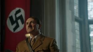 Hitler reoccupies the Rhineland, violating the Treaty of Versailles